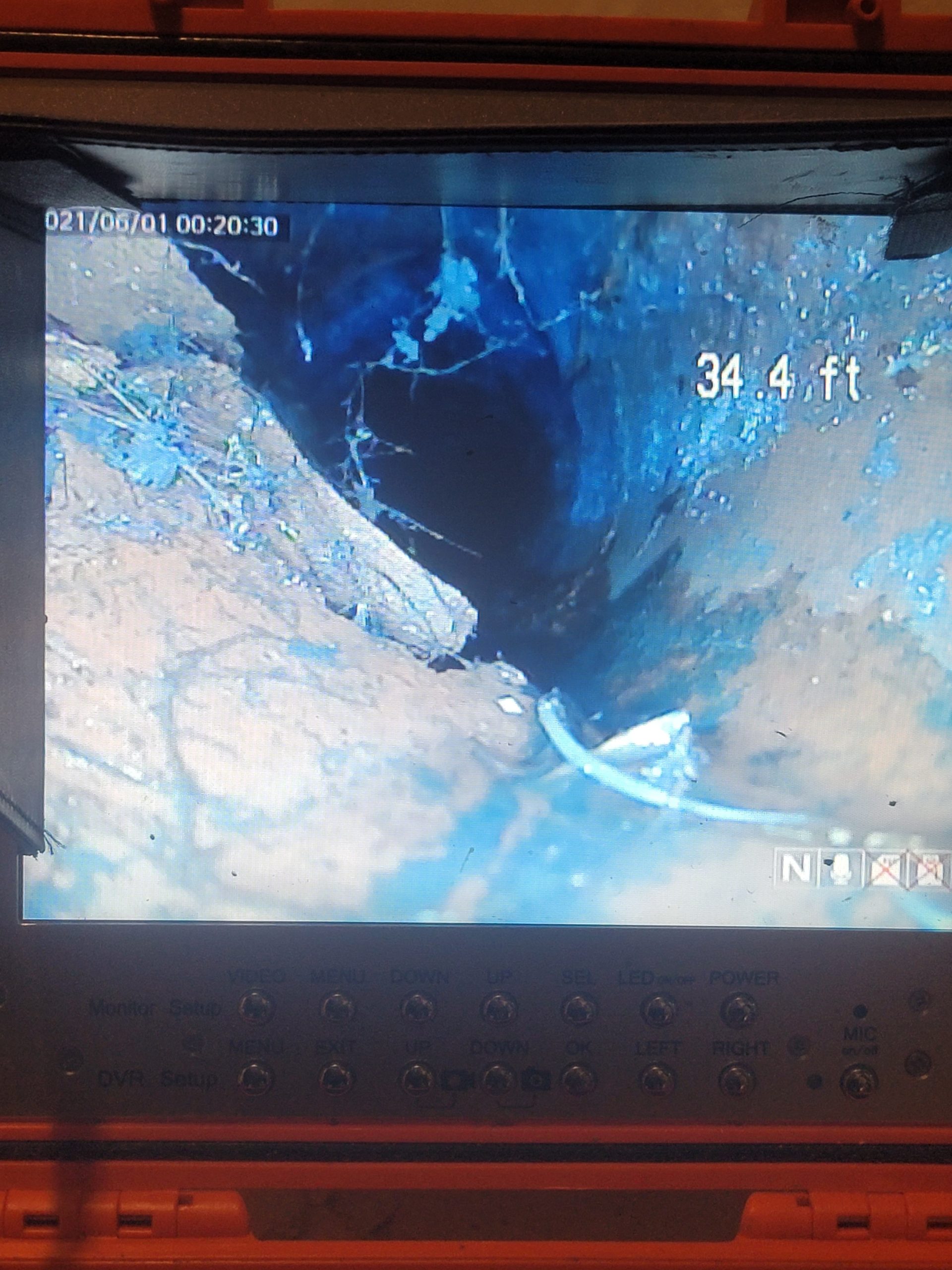Sewer camera inspection monitor showing pipe condition at 34.4 feet down a residential sewer line, captured by Critical Plumbing in Greater Cleveland